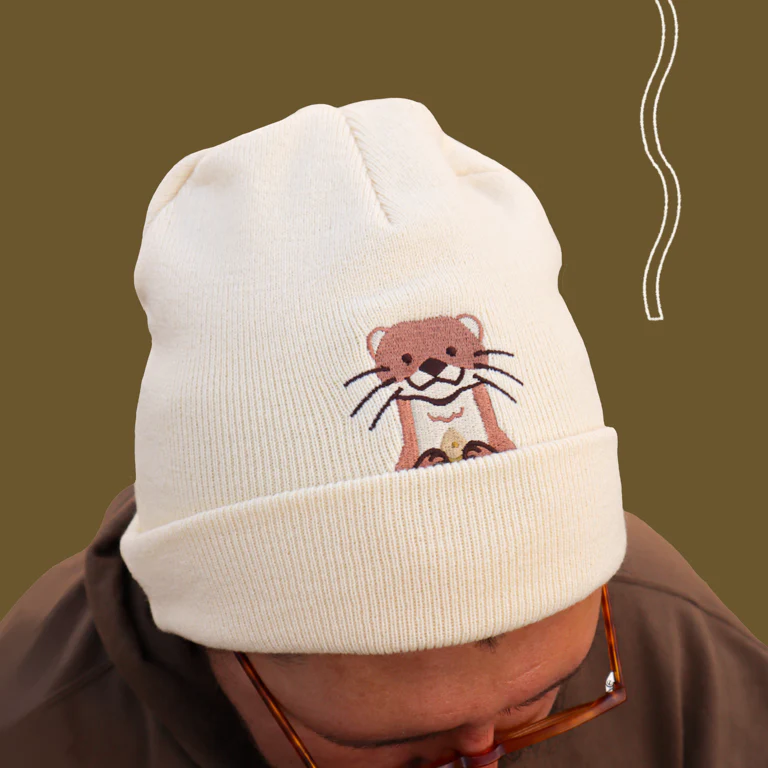 River Otter Peekaboo Beanie Hat - Image 1