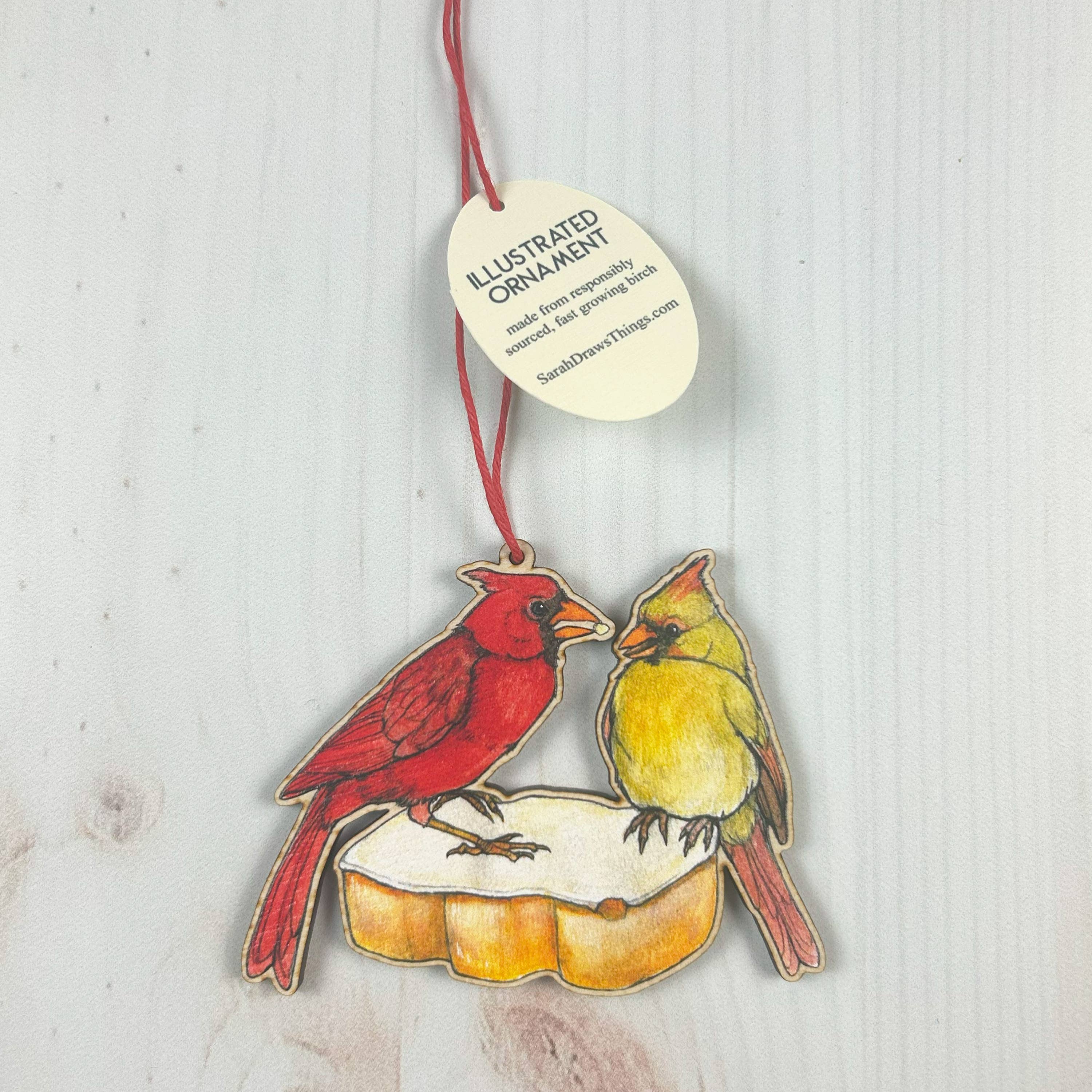 Cardinal Tastykake - 3.5" illustrated wooden tree ornament - Image 1